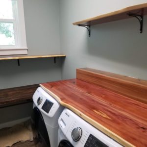 Red cedar laundry room table and shelf with live edge